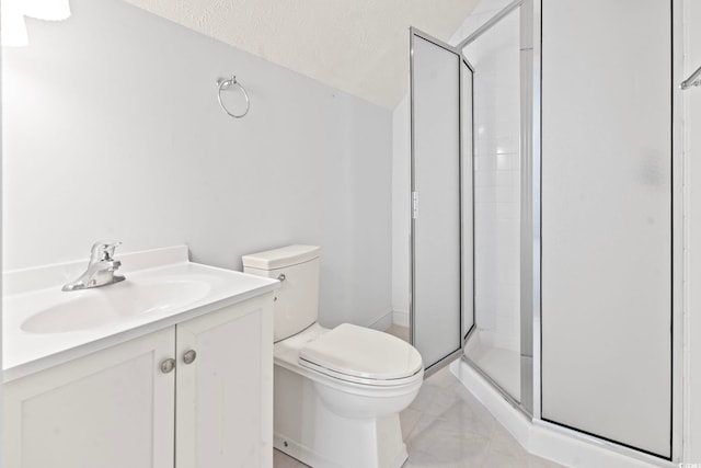 bathroom featuring toilet, vanity, and a stall shower
