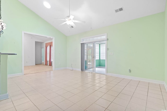 empty room featuring visible vents, light tile patterned floors, baseboards, high vaulted ceiling, and ceiling fan