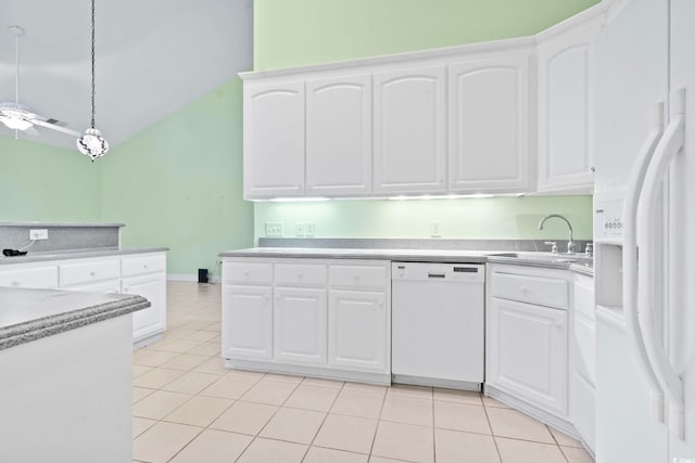 kitchen featuring white cabinets, a sink, light tile patterned flooring, vaulted ceiling, and white appliances
