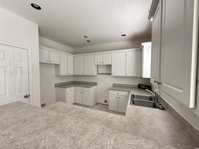 514 Hay Hill Ln Unit C, Myrtle Beach, SC 29579 - kitchen featuring a sink, a peninsula, white cabinets, recessed lighting, and tile patterned flooring