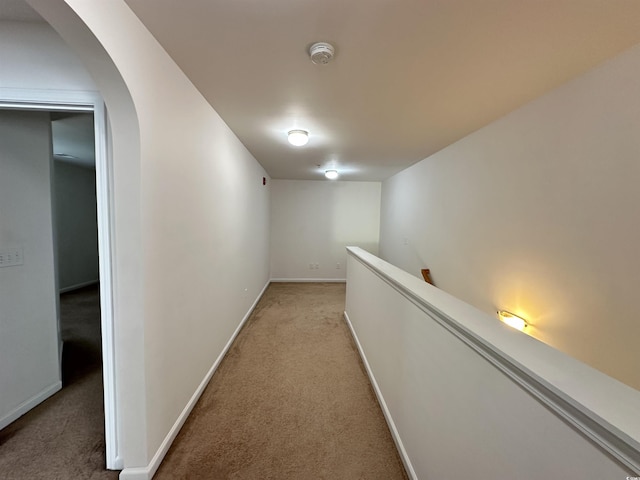 514 Hay Hill Ln Unit C, Myrtle Beach, SC 29579 - hall featuring light carpet, arched walkways, baseboards, and an upstairs landing