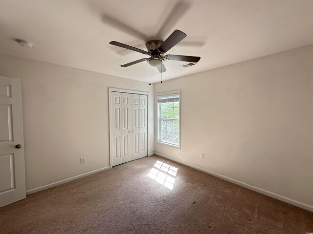 514 Hay Hill Ln Unit C, Myrtle Beach, SC 29579 - unfurnished bedroom with carpet flooring, baseboards, a closet, and ceiling fan