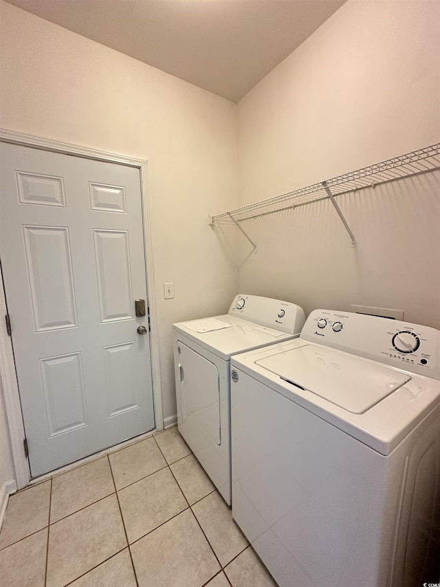 514 Hay Hill Ln Unit C, Myrtle Beach, SC 29579 - washroom with separate washer and dryer, light tile patterned flooring, and baseboards