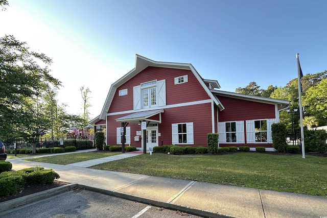 514 Hay Hill Ln Unit C, Myrtle Beach, SC 29579 - colonial inspired home with a gambrel roof, a front yard, and french doors