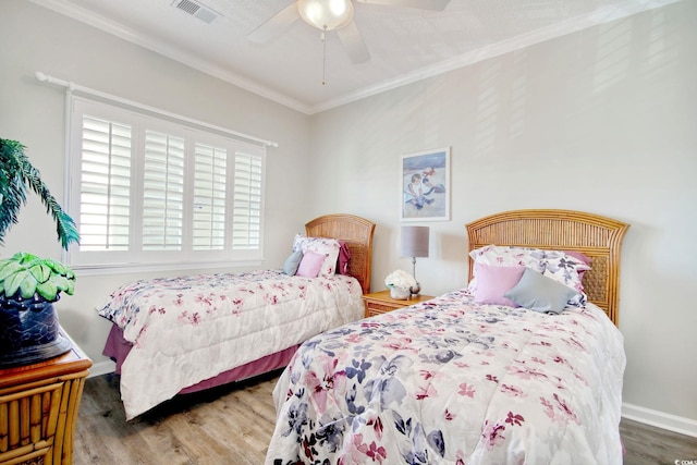 1533 Lanterns Rest Rd Unit 304, Myrtle Beach, SC 29579 - bedroom featuring baseboards, visible vents, a ceiling fan, wood finished floors, and ornamental molding