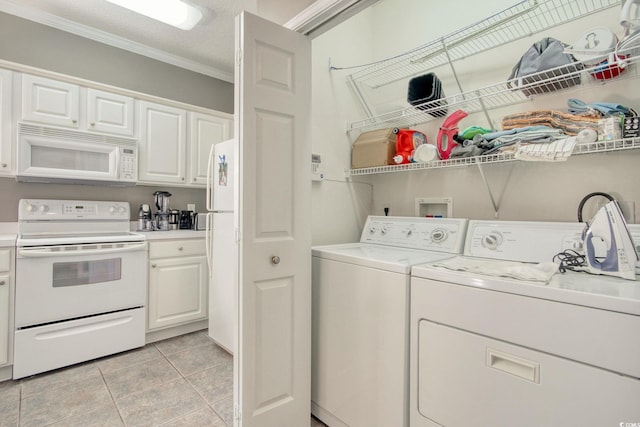 1533 Lanterns Rest Rd Unit 304, Myrtle Beach, SC 29579 - clothes washing area featuring laundry area, crown molding, light tile patterned floors, and washer and clothes dryer