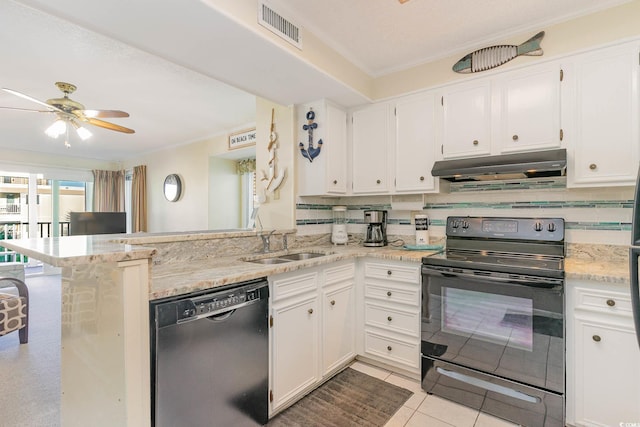 kitchen featuring under cabinet range hood, visible vents, a sink, black appliances, and a peninsula