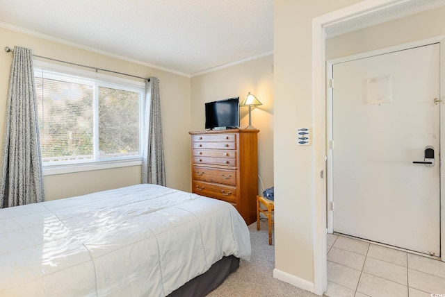 bedroom featuring baseboards and crown molding