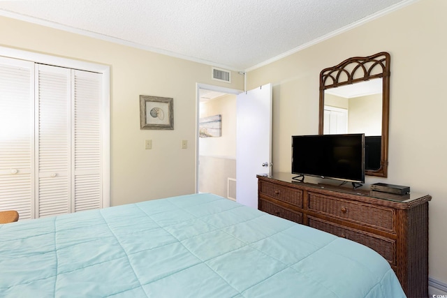 bedroom with visible vents, a closet, crown molding, a baseboard radiator, and a textured ceiling