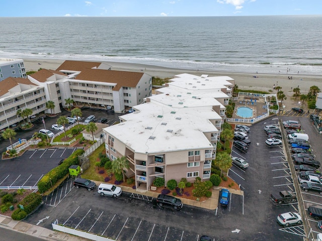 bird's eye view with a view of the beach and a water view