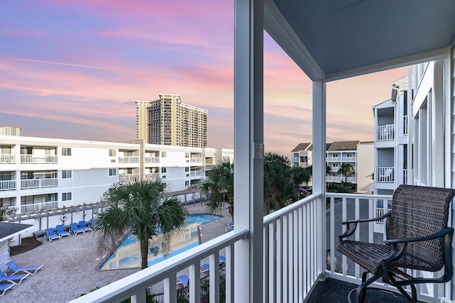 view of balcony at dusk