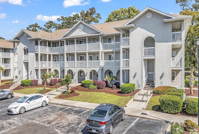 4430 Eastport Blvd Unit L15, Little River, SC 29566 - view of apartment building / complex with uncovered parking