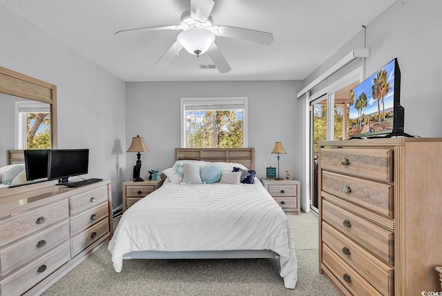 4430 Eastport Blvd Unit L15, Little River, SC 29566 - bedroom with light colored carpet, multiple windows, and a textured ceiling