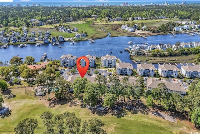 4430 Eastport Blvd Unit L15, Little River, SC 29566 - aerial view of residential area featuring a large body of water and a tree filled landscape