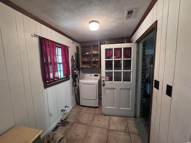2560 Wise Rd, Conway, SC 29526 - clothes washing area featuring light tile patterned floors, a textured ceiling, laundry area, and washer / clothes dryer