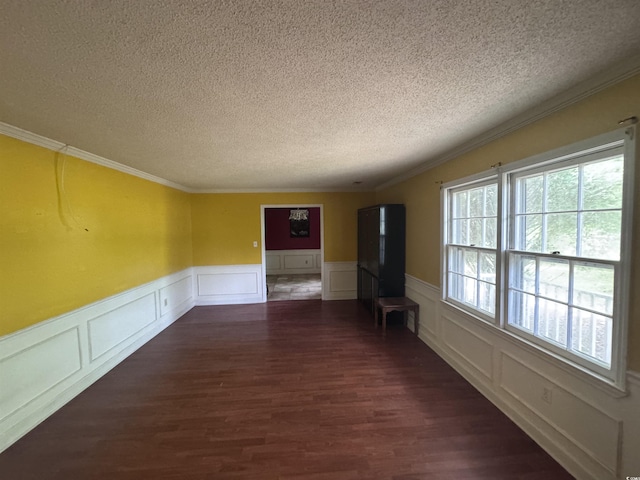 2560 Wise Rd, Conway, SC 29526 - unfurnished room with wainscoting, a decorative wall, and a textured ceiling