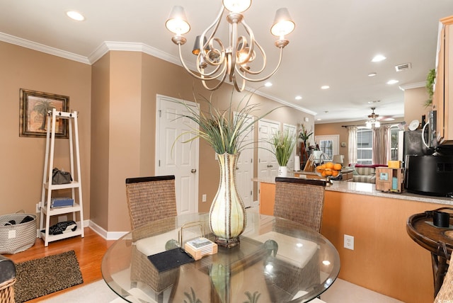 830 Howard Ave Unit D, Myrtle Beach, SC 29577 - dining area with light wood-style floors, ornamental molding, a chandelier, ceiling fan, and recessed lighting