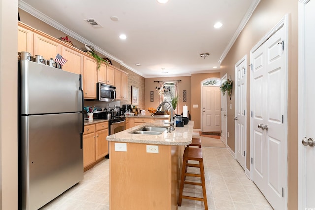 830 Howard Ave Unit D, Myrtle Beach, SC 29577 - kitchen featuring stainless steel appliances, a sink, light brown cabinets, an island with sink, and crown molding
