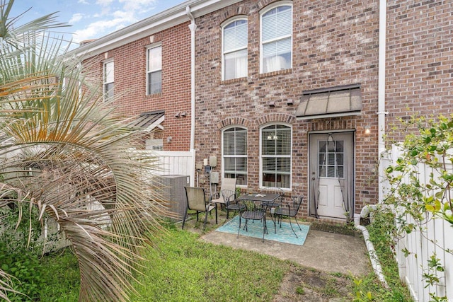 830 Howard Ave Unit D, Myrtle Beach, SC 29577 - rear view of property with brick siding and a patio area