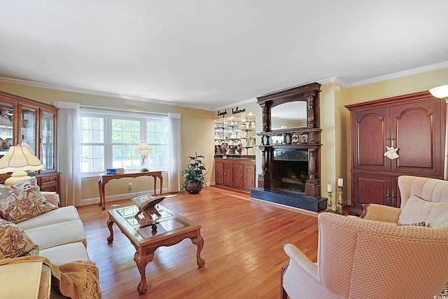 412 43rd Ave N, Myrtle Beach, SC 29577 - living room with light wood-type flooring, a fireplace with raised hearth, crown molding, and baseboards