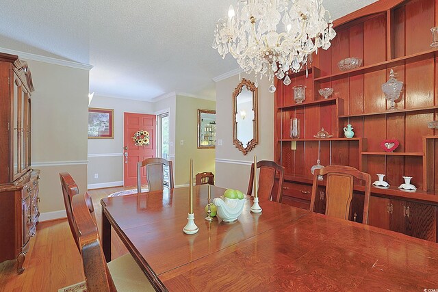 412 43rd Ave N, Myrtle Beach, SC 29577 - dining space with crown molding, a chandelier, wood finished floors, and a textured ceiling