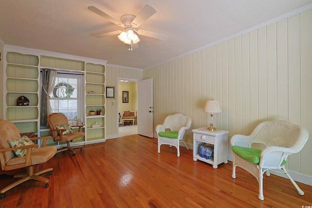 412 43rd Ave N, Myrtle Beach, SC 29577 - sitting room featuring wood finished floors, crown molding, and ceiling fan