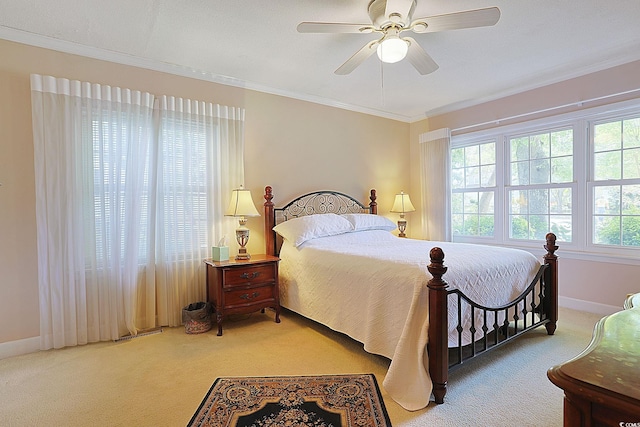 412 43rd Ave N, Myrtle Beach, SC 29577 - carpeted bedroom featuring multiple windows, crown molding, baseboards, and ceiling fan