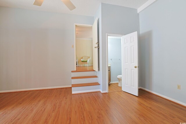 412 43rd Ave N, Myrtle Beach, SC 29577 - unfurnished bedroom with light wood-style floors, baseboards, and a ceiling fan