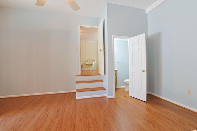 412 43rd Ave N, Myrtle Beach, SC 29577 - unfurnished bedroom with light wood-style floors, baseboards, and a ceiling fan