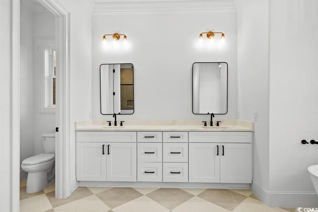 1219 Bentcreek Ln, Myrtle Beach, SC 29579 - full bathroom featuring toilet, double vanity, crown molding, and tile patterned floors