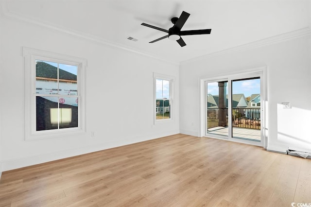 1219 Bentcreek Ln, Myrtle Beach, SC 29579 - spare room with crown molding, light wood-style floors, plenty of natural light, a ceiling fan, and baseboards