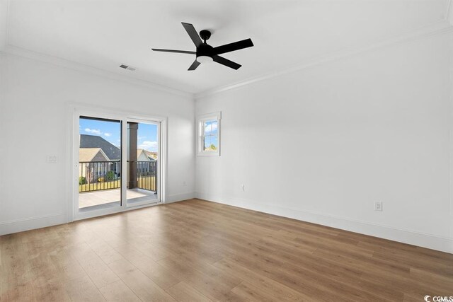 1219 Bentcreek Ln, Myrtle Beach, SC 29579 - spare room featuring crown molding, wood finished floors, baseboards, and ceiling fan