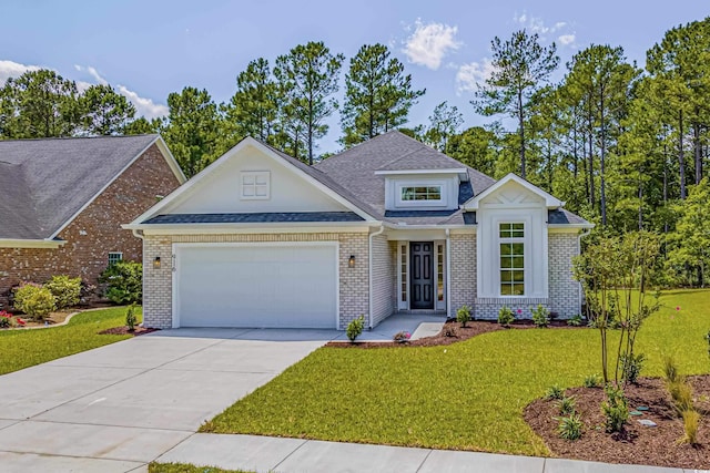 4932 S Island Dr, North Myrtle Beach, SC 29582 - view of front of home featuring an attached garage, a front yard, driveway, brick siding, and a shingled roof