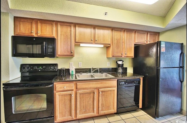 504 N Ocean Blvd Unit 1810, Myrtle Beach, SC 29577 - kitchen with a sink, a textured ceiling, brown cabinetry, black appliances, and light tile patterned floors