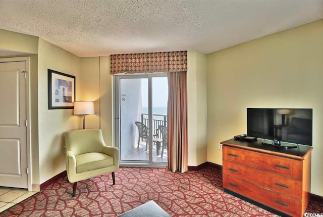 504 N Ocean Blvd Unit 1810, Myrtle Beach, SC 29577 - sitting room with carpet, baseboards, and a textured ceiling