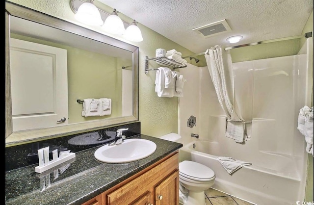 504 N Ocean Blvd Unit 1810, Myrtle Beach, SC 29577 - bathroom featuring vanity, a textured ceiling, toilet, visible vents, and shower / bath combination with curtain