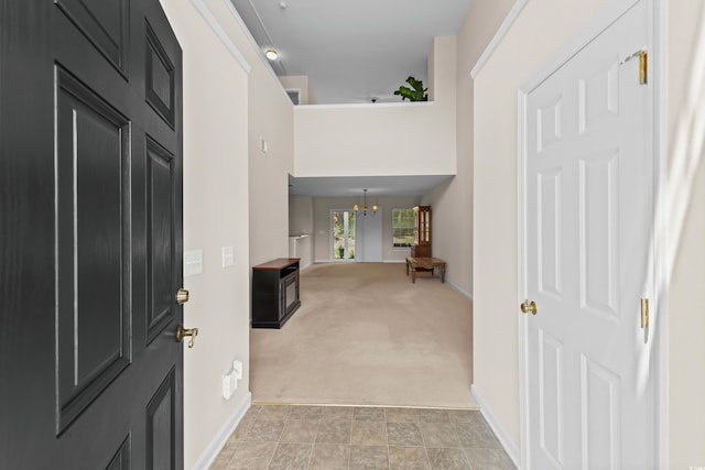 1004 Harvester Cir Unit 1004, Myrtle Beach, SC 29579 - entryway featuring a chandelier, baseboards, and light carpet