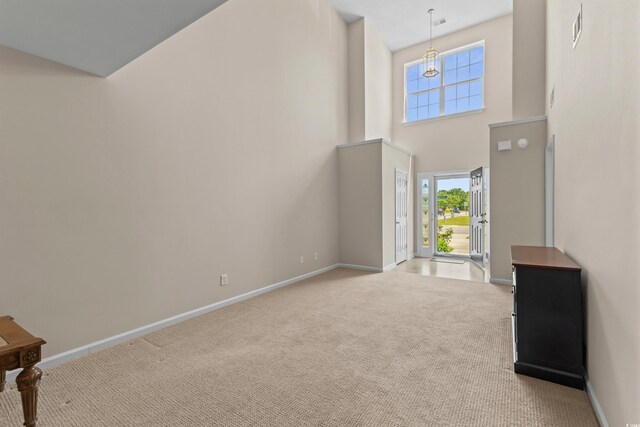 1004 Harvester Cir Unit 1004, Myrtle Beach, SC 29579 - foyer entrance with carpet flooring, baseboards, and a towering ceiling