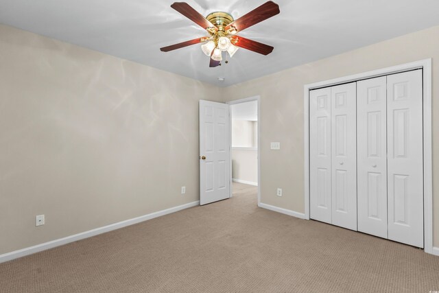 1004 Harvester Cir Unit 1004, Myrtle Beach, SC 29579 - unfurnished bedroom featuring baseboards, light carpet, a closet, and a ceiling fan