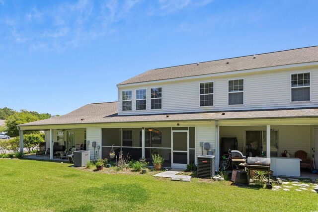 1004 Harvester Cir Unit 1004, Myrtle Beach, SC 29579 - rear view of property featuring cooling unit, a lawn, and a patio area
