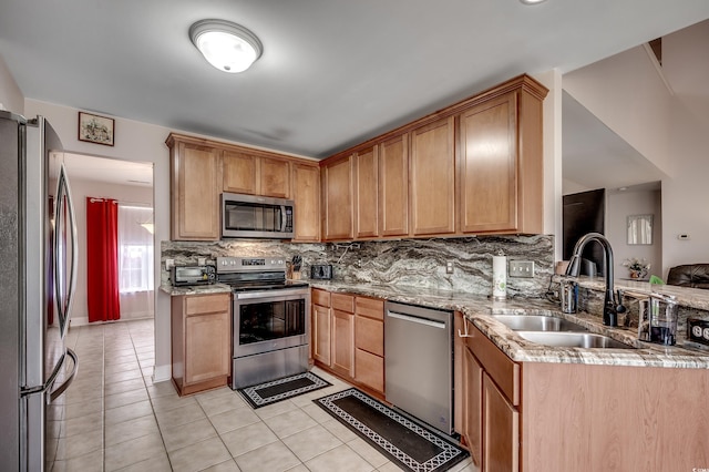1001 Harvest View Ave, Conway, SC 29527 - kitchen with stainless steel appliances, light tile patterned flooring, backsplash, and light stone counters