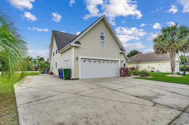 1001 Harvest View Ave, Conway, SC 29527 - view of property exterior featuring a garage, concrete driveway, a lawn, and roof with shingles