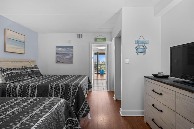 208 74th Ave N Unit 2517, Myrtle Beach, SC 29572 - bedroom featuring dark wood-style flooring and baseboards