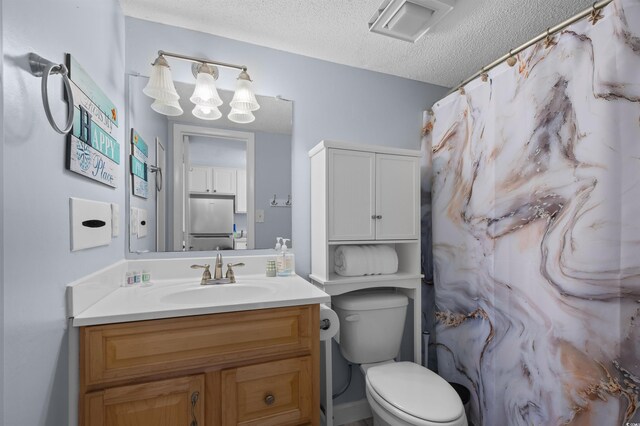 208 74th Ave N Unit 2517, Myrtle Beach, SC 29572 - full bathroom featuring a textured ceiling, vanity, and curtained shower