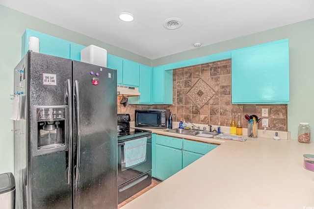 kitchen with black appliances, under cabinet range hood, a sink, and tasteful backsplash