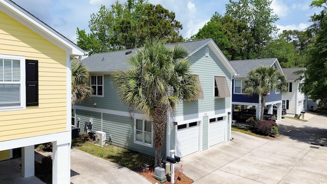 1131 Camellia Dr, Surfside Beach, SC 29575 - view of side of property with driveway and a garage