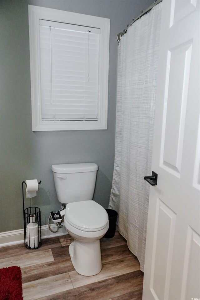 1131 Camellia Dr, Surfside Beach, SC 29575 - full bath with wood finished floors and a shower with shower curtain
