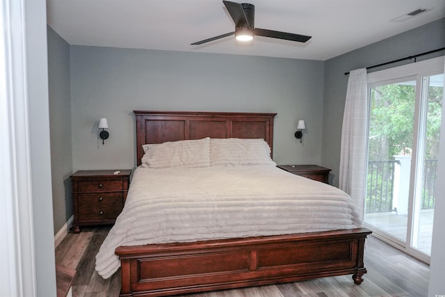 bedroom featuring access to outside, light wood-type flooring, and ceiling fan