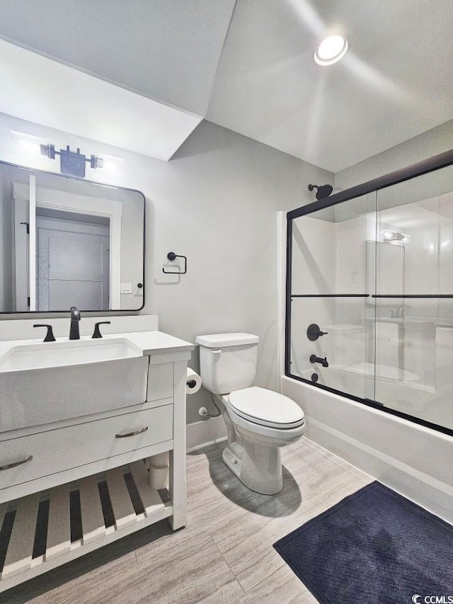2300 Tansy Rd, Loris, SC 29569 - bathroom with vanity, enclosed tub / shower combo, toilet, and baseboards