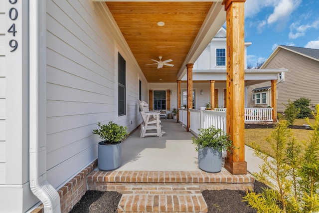 view of exterior entry with covered porch